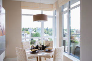 Breakfast nook surrounded by picture windows in condo
